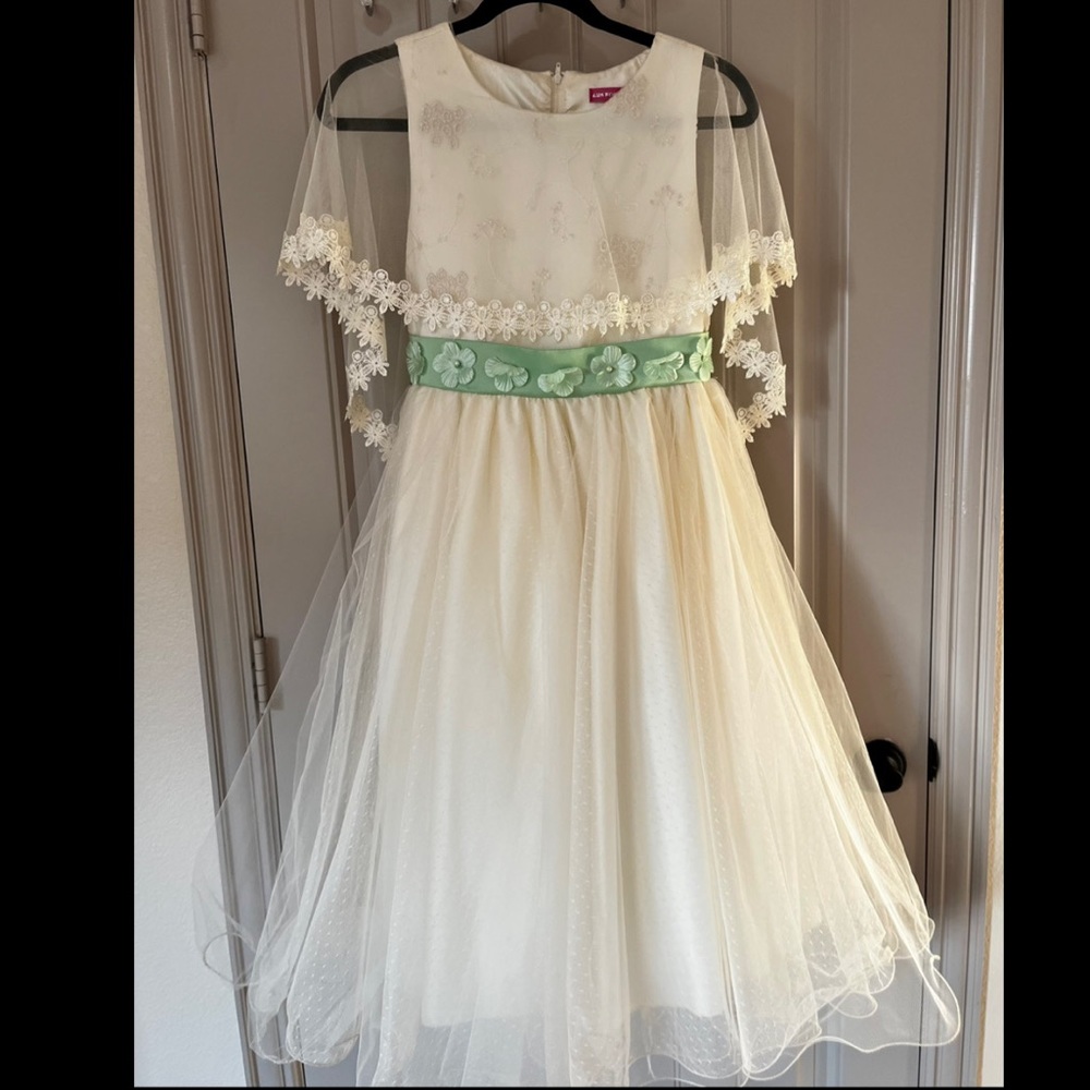 Super fancy, formal, and cute girl dress. Size 14. Cream dress with green belt.